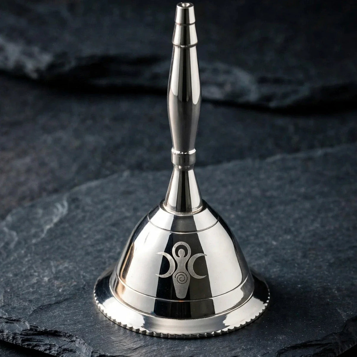 Goddess of Earth silver altar bell on dark slate