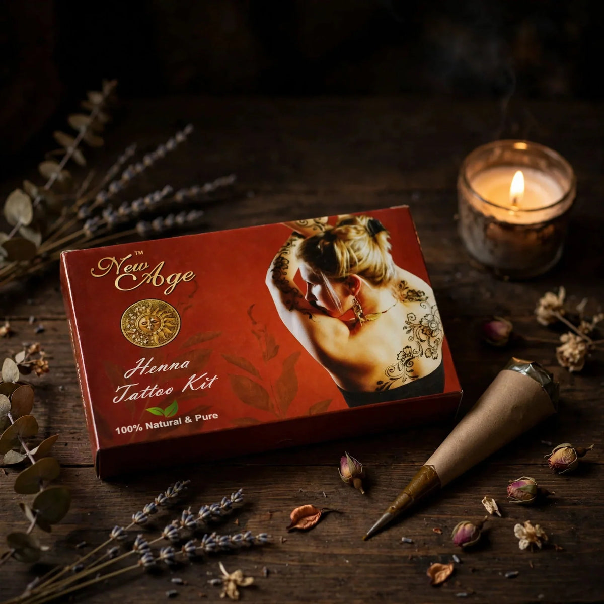 Henna Tattoo Kit box with applicator cone and candle on dark table