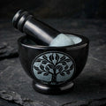 Tree of Life black soapstone mortar and pestle on dark slate