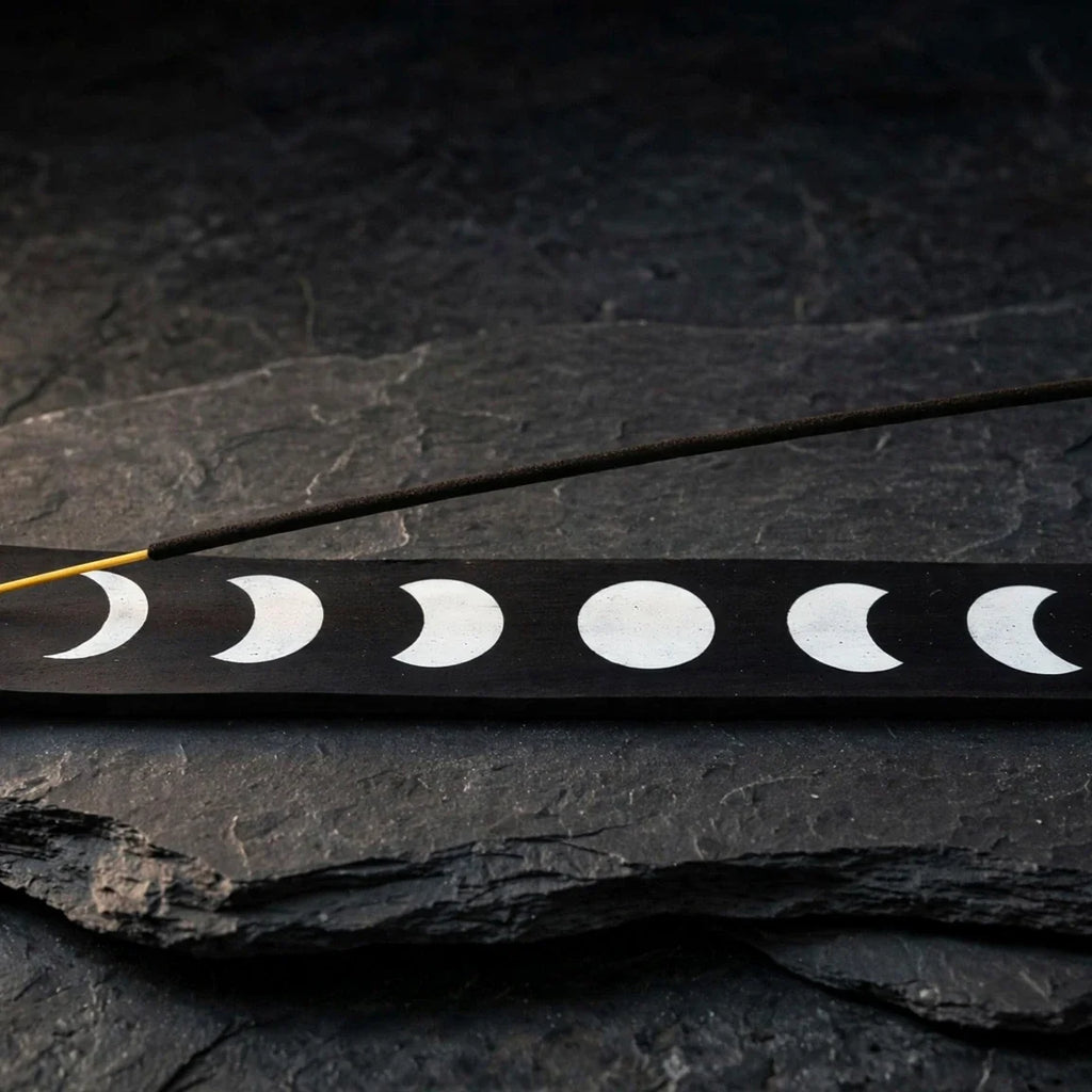 Moon phase black wood ash catcher on dark slate