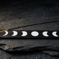 Moon phase black wood ash catcher on dark slate