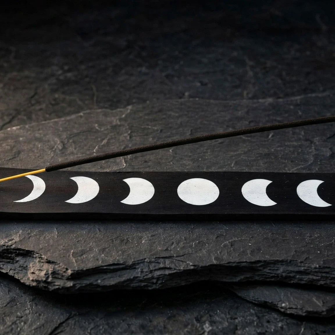 Moon phase black wood ash catcher on dark slate